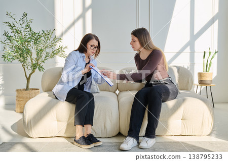 Young woman patient in therapy session talking with female psychotherapist Young woman patient in therapy session talking with female psychotherapist 138795233