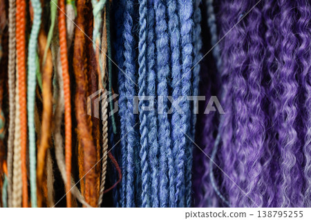 Colorful braid extensions texture background with blue and purple strands 138795255
