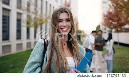 Happy university student smiling on campus 138795483
