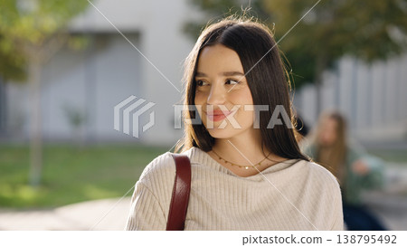 Young female student smiling on university campus Young female student smiling on university campus 138795492