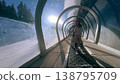 Little girl skiing on conveyor lift in the French Alps winter resort 138795709