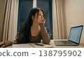 A young woman studying 138795902
