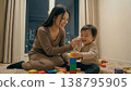 Parent and child playing with toys 138795905