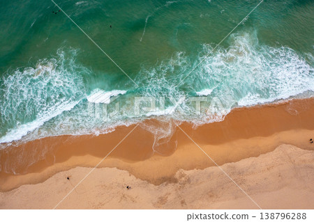 Serene Aerial View of an Empty Ocean Beach 138796288