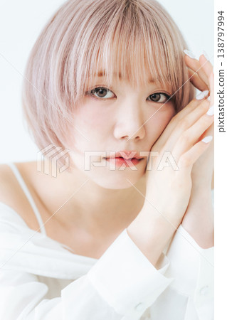 Beauty and fashion image of a woman with light-toned short bob hair. Beauty and fashion image of a woman with light-toned short bob hair. 138797994