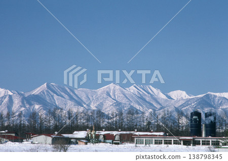 Wintertime view of the Hidaka Mountains and farms (Obihiro City, Hokkaido) Wintertime view of the Hidaka Mountains and farms (Obihiro City, Hokkaido) 138798345