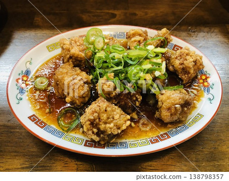 Taiwanese-style sweet and sour pork served on a Chinese-style plate; deep-fried pork with sweet and sour sauce. Taiwanese-style sweet and sour pork served on a Chinese-style plate; deep-fried pork with sweet and sour sauce. 138798357
