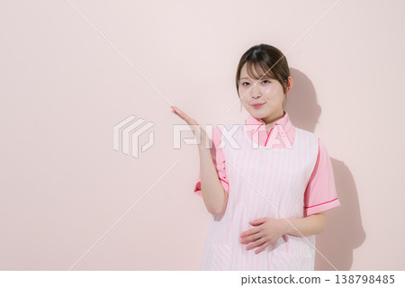 A pink background shows images of women working as caregivers or childcare workers, illustrating the rewarding nature of home care work and providing guidance with their hands. 138798485