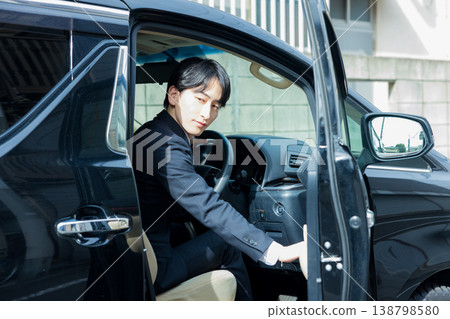 Businessman driving a car Businessman driving a car 138798580