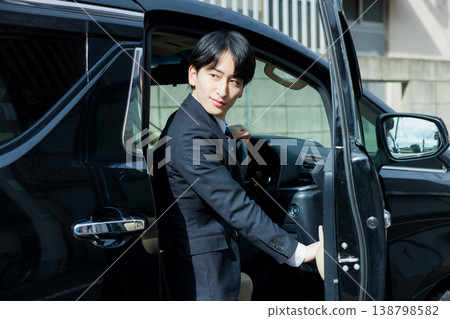 Businessman driving a car Businessman driving a car 138798582