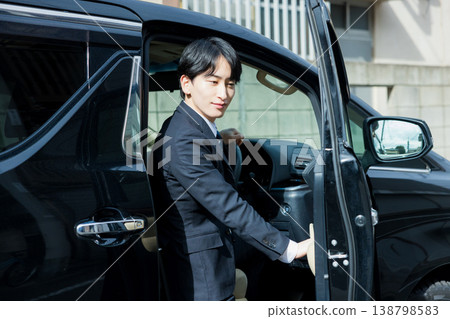 Businessman driving a car Businessman driving a car 138798583
