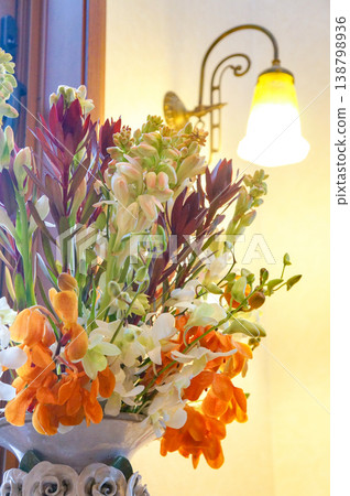 Gladiolus in the entrance hall, illuminated by light. Gladiolus in the entrance hall, illuminated by light. 138798936