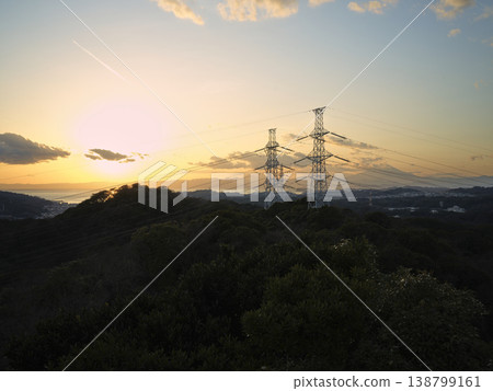 Power transmission towers and hilly landscape Power transmission towers and hilly landscape 138799161