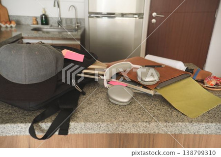 Student backpack headphones and books on kitchen counter Student backpack headphones and books on kitchen counter 138799310