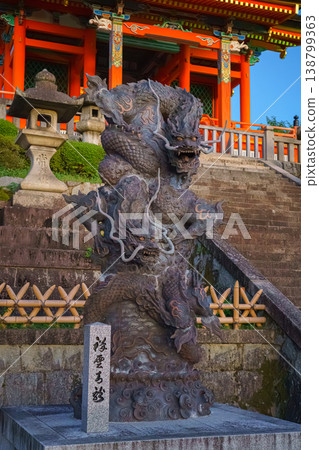 Kyoto, Japan - Sep 23 2024, vertical, close-up view of stone statue of two writhing dragons near stairs in front of entrance to Pure Water Kiyomizu Dera Temple, with shrine on background, Kyoto, Japan Kyoto, Japan - Sep 23 2024, vertical, close-up view of stone statue of two writhing dragons near stairs in front of entrance to Pure Water Kiyomizu Dera Temple, with shrine on background, Kyoto, Japan 138799363