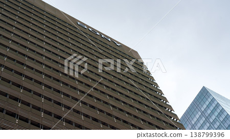 Tokyo, Japan - Sep 30 2024, panoramic view from below of the facade of a multi-storey wide office building in Sony City Osaki, against a cloudy gray sky, at daytime, Tokyo, Japan Tokyo, Japan - Sep 30 2024, panoramic view from below of the facade of a multi-storey wide office building in Sony City Osaki, against a cloudy gray sky, at daytime, Tokyo, Japan 138799396