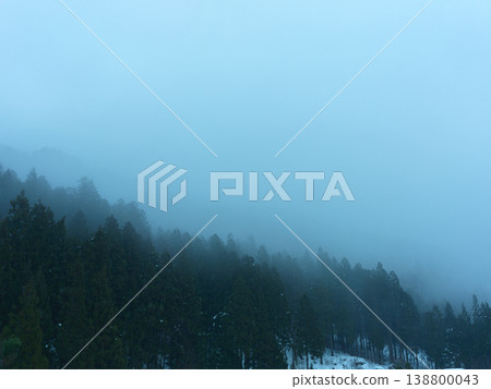 Snow-covered mountains and fog: Winter mountain scenery Snow-covered mountains and fog: Winter mountain scenery 138800043