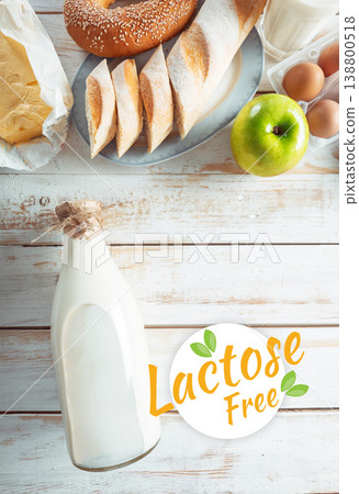 Lactose and gluten free foods on a wooden table with milk and baked items Lactose and gluten free foods on a wooden table with milk and baked items 138800518