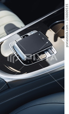 Close view of a car's center console with controls and a touchpad at night Close view of a car's center console with controls and a touchpad at night 138800535