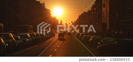 Saint-Petersburg, Russia - April 10 2026, panoramic view of Nevsky Prospect, cars on road, people walking on sidewalk, at sunset with bright sun, everything in orange light, St Petersburg, Russia Saint-Petersburg, Russia - April 10 2026, panoramic view of Nevsky Prospect, cars on road, people walking on sidewalk, at sunset with bright sun, everything in orange light, St Petersburg, Russia 138800553
