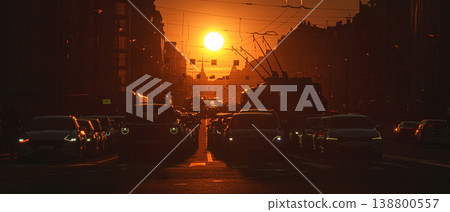 Saint-Petersburg, Russia - April 10 2026, panoramic view of Nevsky Prospect, cars on road, people walking on sidewalk, at sunset with bright sun, everything in orange light, St Petersburg, Russia Saint-Petersburg, Russia - April 10 2026, panoramic view of Nevsky Prospect, cars on road, people walking on sidewalk, at sunset with bright sun, everything in orange light, St Petersburg, Russia 138800557