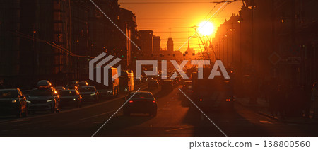 Saint-Petersburg, Russia - April 10 2026, panoramic view of Nevsky Prospect, cars on road, people walking on sidewalk, at sunset with bright sun, everything in orange light, St Petersburg, Russia Saint-Petersburg, Russia - April 10 2026, panoramic view of Nevsky Prospect, cars on road, people walking on sidewalk, at sunset with bright sun, everything in orange light, St Petersburg, Russia 138800560
