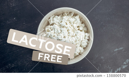 Bowl of cottage cheese labeled as lactose gluten free with plain background 138800570