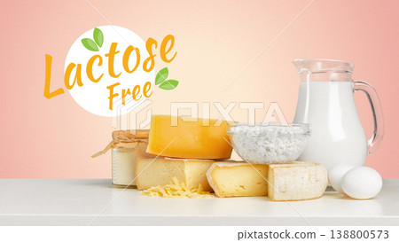 Product display of lactose free items on a simple table with a pink background 138800573