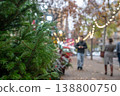 Christmas tree market in the city with shoppers during holiday season in December 138800750