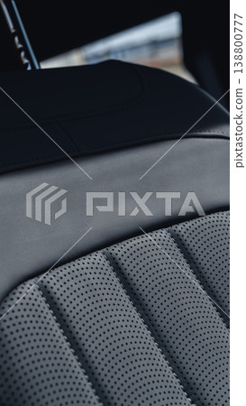 Close up view of a car seat showing leather texture and stitching patterns Close up view of a car seat showing leather texture and stitching patterns 138800777