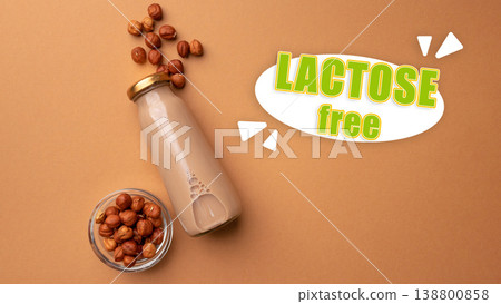Lactose free drink and nuts placed on a simple background with natural light 138800858