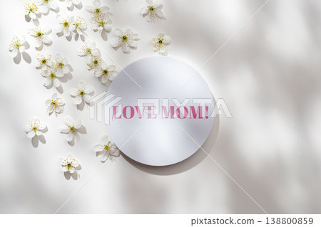 Celebrating Mother's Day with a simple card on May 10 surrounded by small white flowers Celebrating Mother's Day with a simple card on May 10 surrounded by small white flowers 138800859