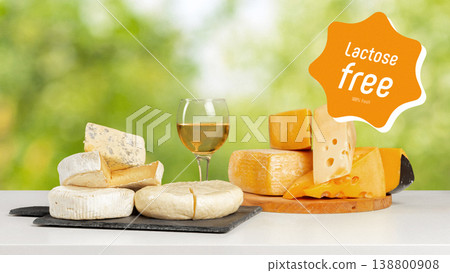Cheese selection featuring lactose and gluten free varieties with white wine on table Cheese selection featuring lactose and gluten free varieties with white wine on table 138800908
