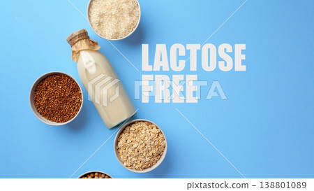 Lactose free milk with grains displayed on a blue background in a kitchen setting 138801089