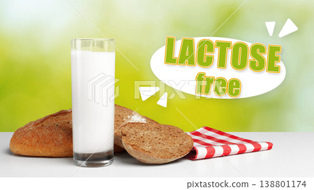 Lactose and gluten free bread with glass of milk on white table in bright setting 138801174
