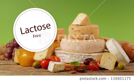 Lactose free cheese display with fresh ingredients and vegetables on a wooden table Lactose free cheese display with fresh ingredients and vegetables on a wooden table 138801175