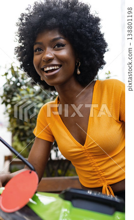 Young woman enjoys outdoor gardening in a sunny location during spring season Young woman enjoys outdoor gardening in a sunny location during spring season 138801198