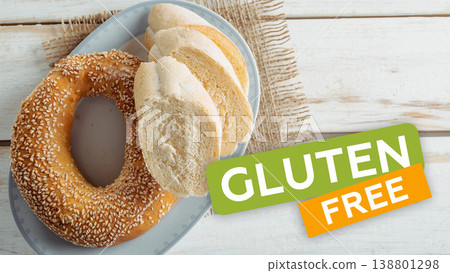 Gluten free bagel and bread on a plate with a simple background Gluten free bagel and bread on a plate with a simple background 138801298