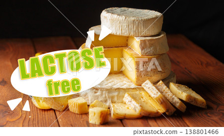 Lactose and gluten free cheese served on a wooden table with sliced pieces Lactose and gluten free cheese served on a wooden table with sliced pieces 138801466