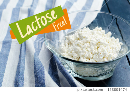 Lactose free cottage cheese served in a clear bowl on a blue and white striped tablecloth Lactose free cottage cheese served in a clear bowl on a blue and white striped tablecloth 138801474