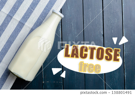 Lactose free milk placed on a striped cloth with wooden background Lactose free milk placed on a striped cloth with wooden background 138801491