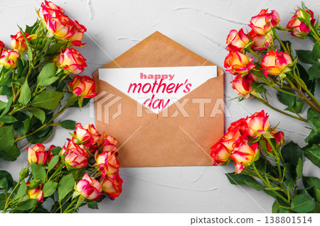 Celebrating Mother's Day with flowers and a card on May 10 Celebrating Mother's Day with flowers and a card on May 10 138801514