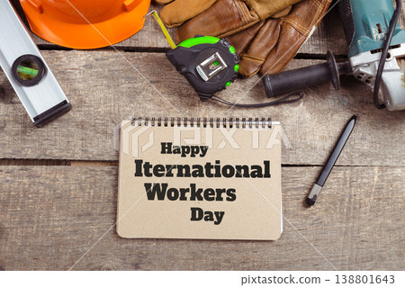 Celebrate international workers day on May 1 with tools and safety gear on a wooden surface Celebrate international workers day on May 1 with tools and safety gear on a wooden surface 138801643