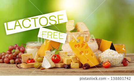 Lactose free cheese options with fruits and snacks on a wooden table Lactose free cheese options with fruits and snacks on a wooden table 138801742