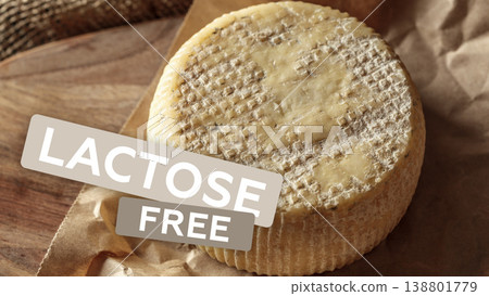 Lactose free cheese on a wooden board with plain brown packaging at a local market Lactose free cheese on a wooden board with plain brown packaging at a local market 138801779