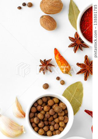 Spice selection on a white surface with whole spices and seasoning blends at different angles Spice selection on a white surface with whole spices and seasoning blends at different angles 138801785