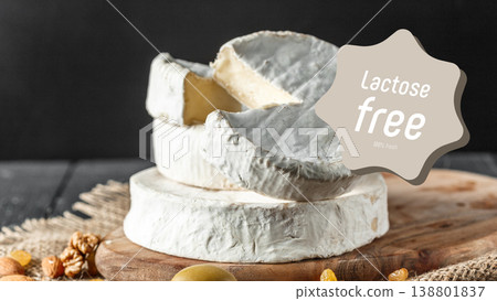 Cheese on wooden board shows lactose free and gluten free options for dietary needs Cheese on wooden board shows lactose free and gluten free options for dietary needs 138801837