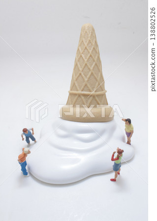 Miniature Figures Surrounding Giant Ice Cream Miniature Figures Surrounding Giant Ice Cream 138802526
