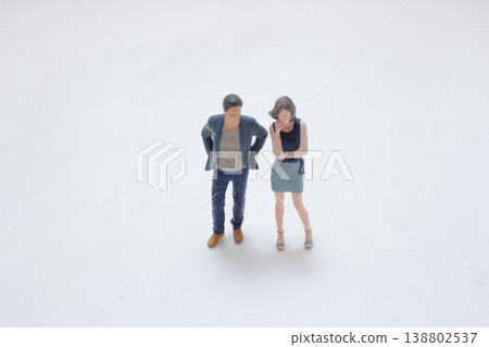 Miniature Couple Standing In Quiet Moment Miniature Couple Standing In Quiet Moment 138802537
