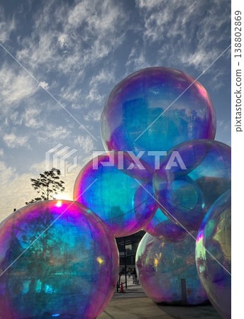 A giant balloon installation glowing in rainbow colors against the twilight sky at Kobe Port A giant balloon installation glowing in rainbow colors against the twilight sky at Kobe Port 138802869
